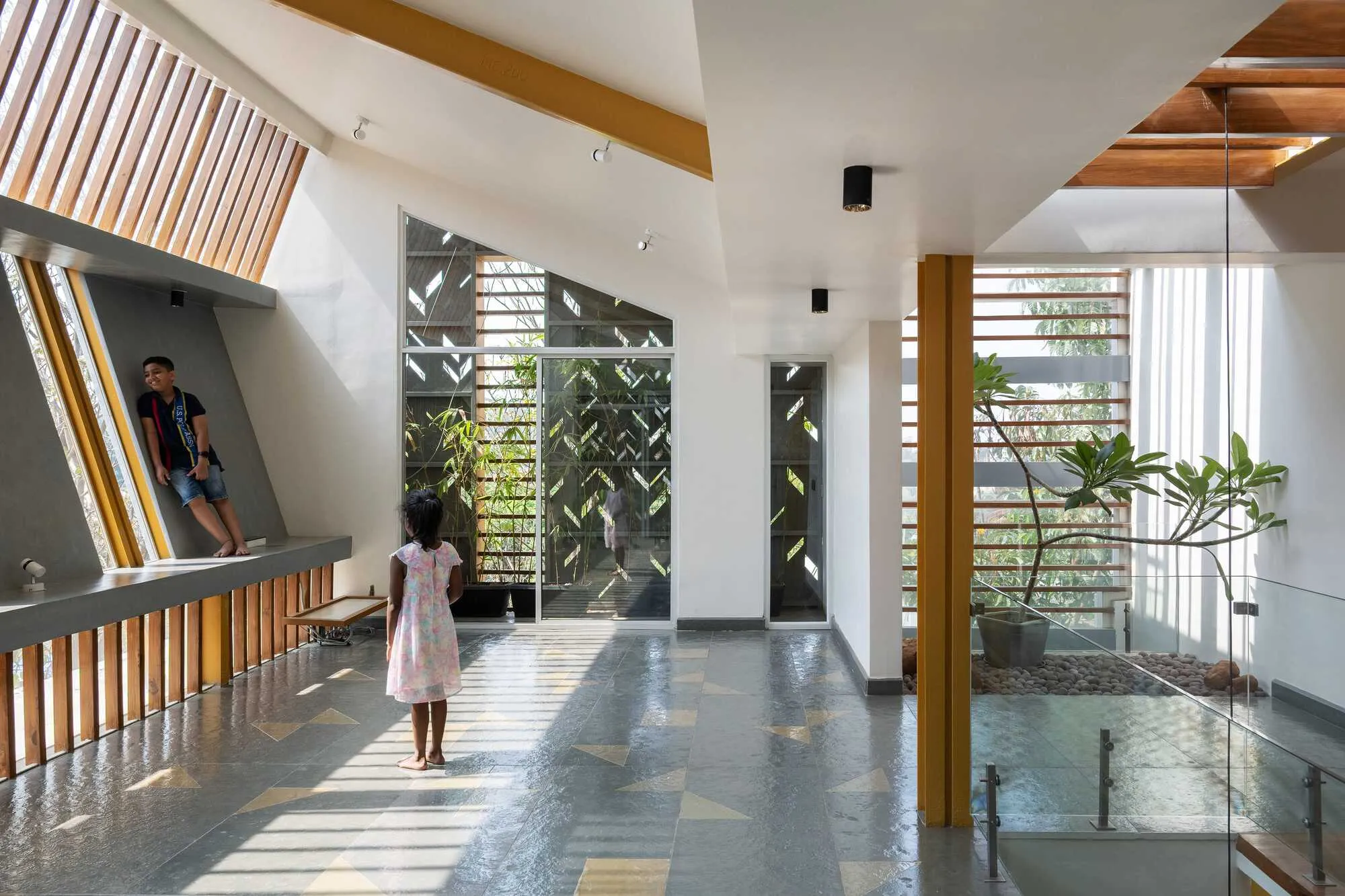 Studio WhiteScape Wraps a Bengaluru Home in Concrete Lace and Trumpet Tree Gold