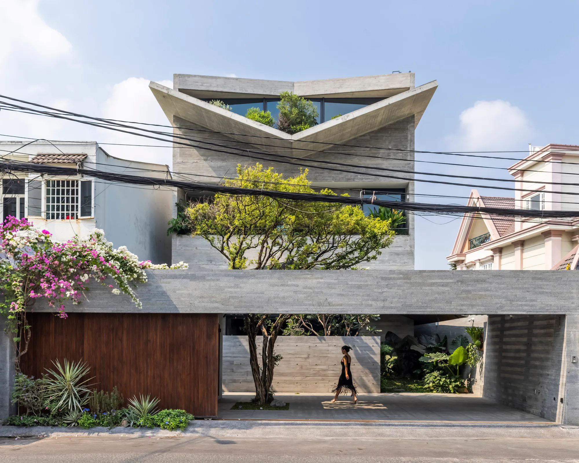23o5Studio Folds Concrete and Canopy into a Layered Urban House in Ho Chi Minh City