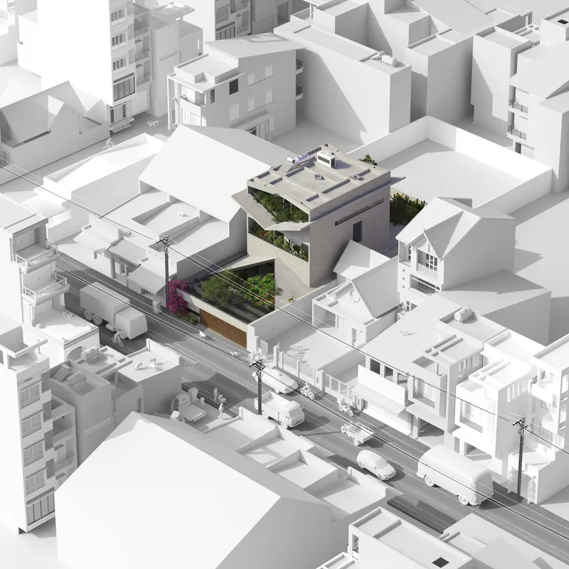 Aerial view of architectural model showing stacked volumes with planted terraces in dense urban context