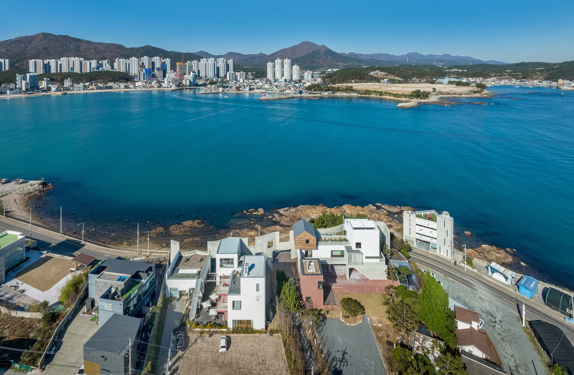 Hyunjoon Yoo Architects Anchor a Fragmented Coastal Village into Busan's Rocky Shoreline