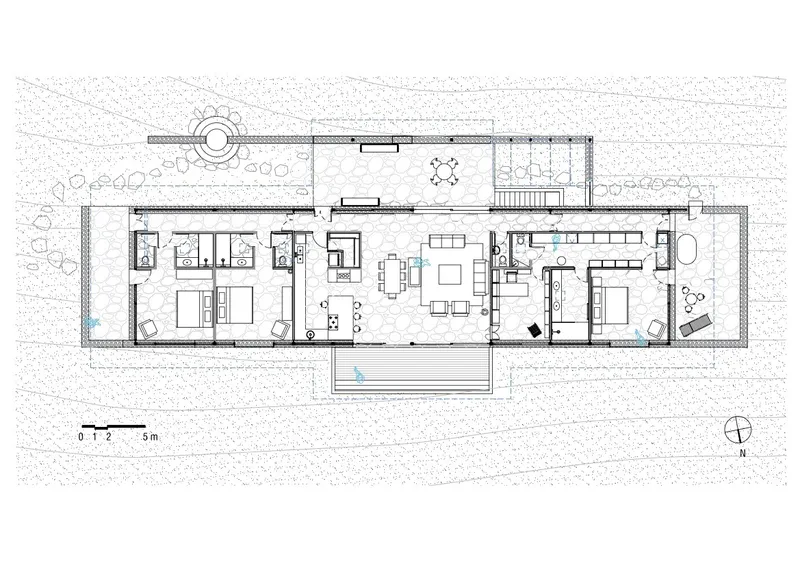 Floor plan drawing showing linear arrangement of bedrooms and living spaces with central courtyard