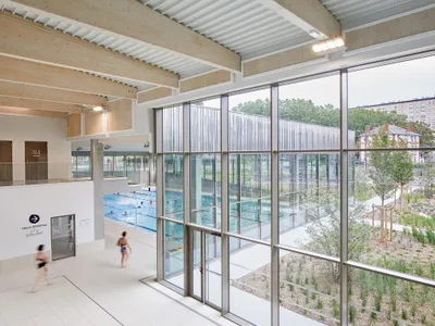 ANMA Converts the Site of a Former Orléans Jail into a Timber-Framed Aquatic Center