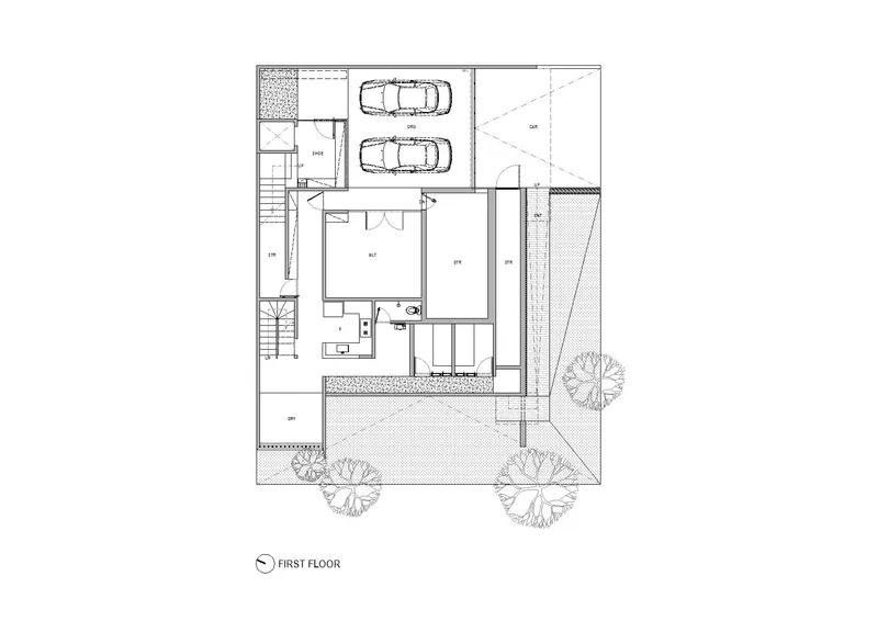 First floor plan showing double garage, interior rooms and landscaped courtyard with trees