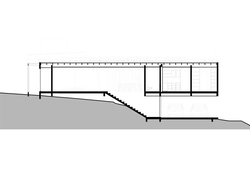 Section drawing revealing an interior staircase descending into a lower level on sloping terrain