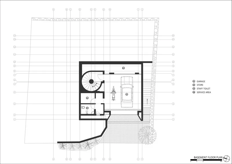 Basement floor plan showing garage, storage rooms, and circular staircase