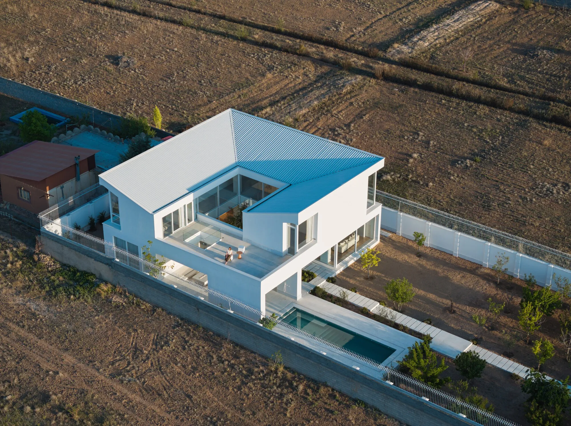 Kanisavaran Office Turns a Central Courtyard into a Light Engine on the Plains of Damavand