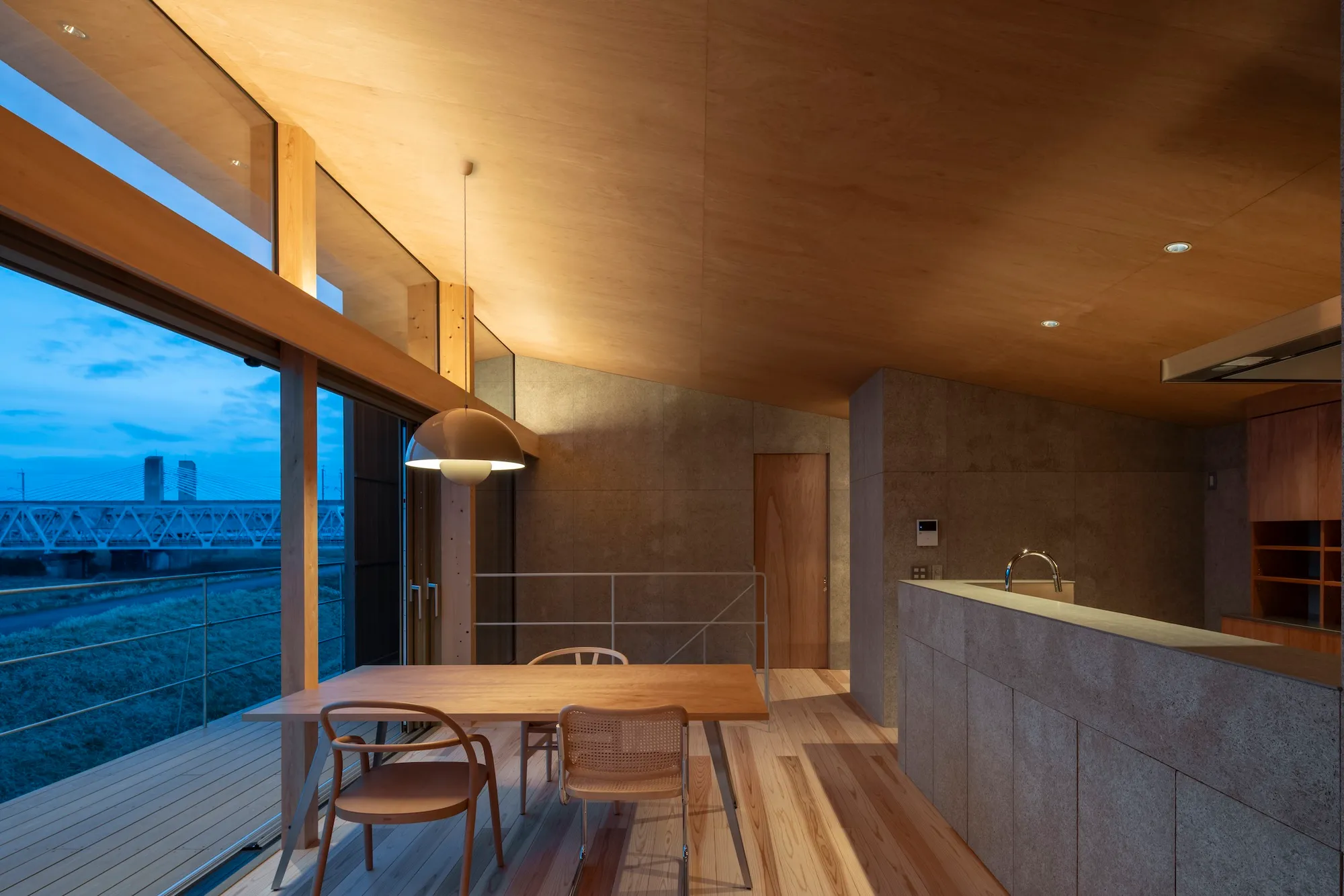 studioSHUWARI Frames the Tateyama Mountains from a Toyama Riverbank House