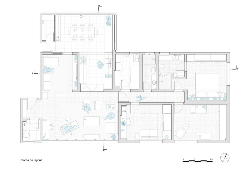 Floor plan drawing showing an L-shaped apartment layout with open living spaces and multiple bedrooms