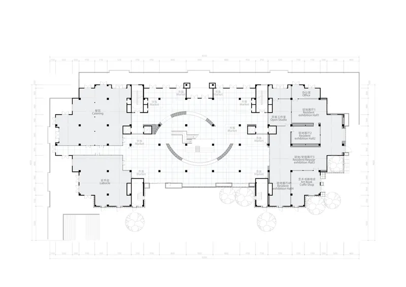 Floor plan drawing showing two curved staircases flanking a central space with perimeter rooms
