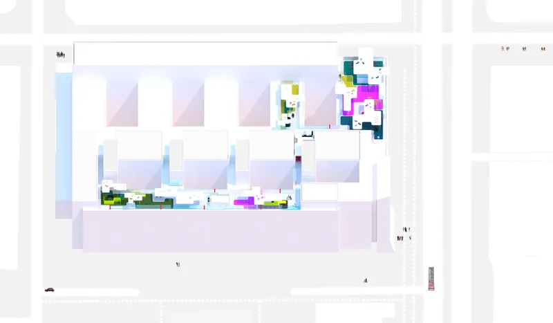 Site plan drawing showing the building footprint with colorful zones distributed across the rooftop and courtyard areas
