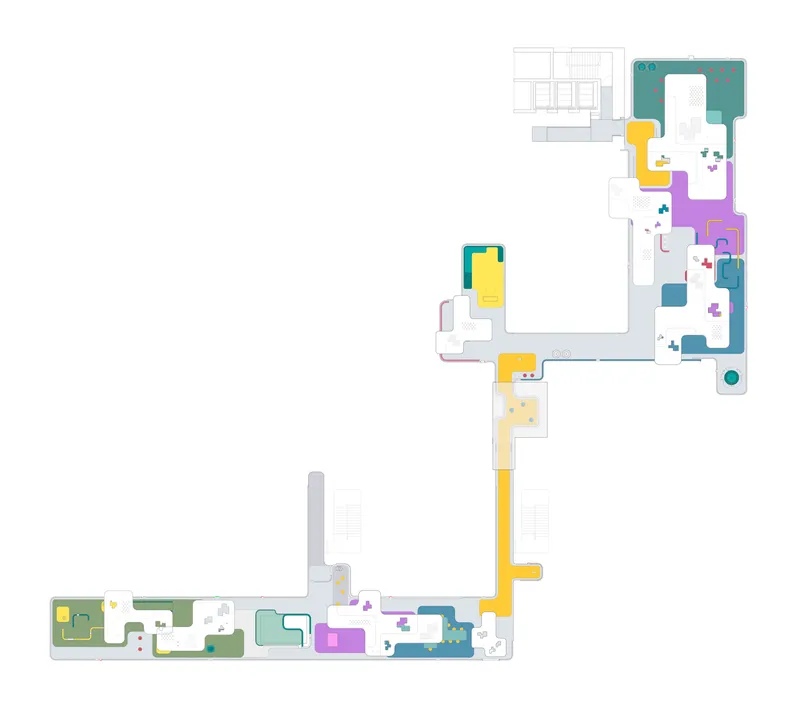 Floor plan drawing showing the same L-shaped layout with color-coded zones and a central courtyard void