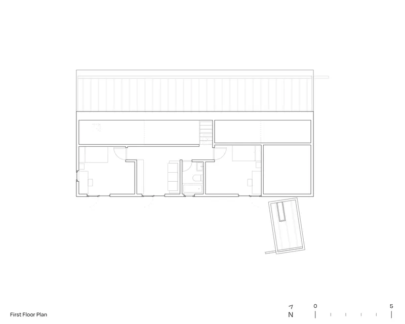 First floor plan drawing showing bedroom spaces with a pitched roof indicated above