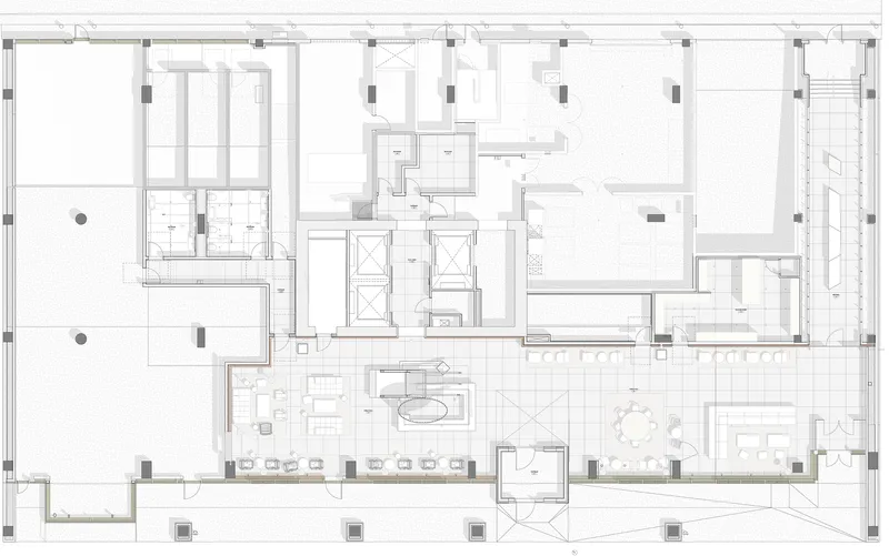 Floor plan drawing showing residential units arranged around a central core with double-height spaces