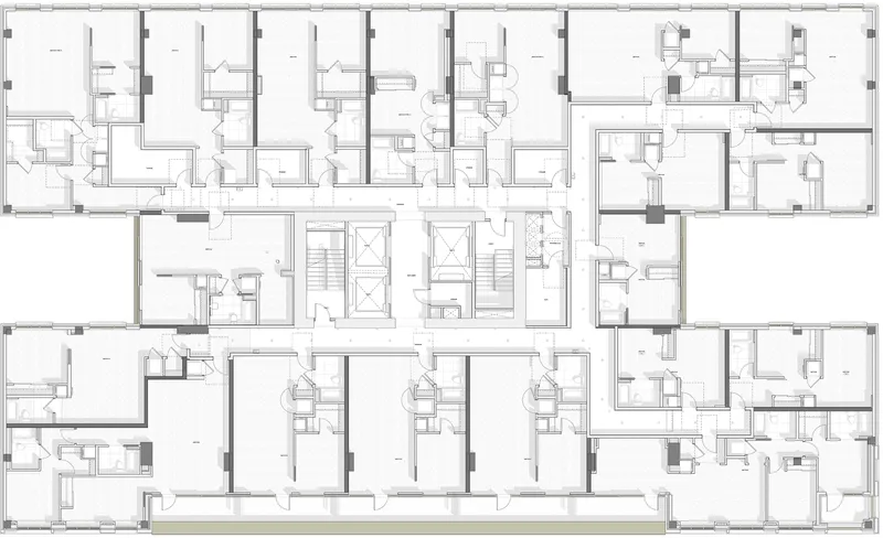 Floor plan drawing showing a typical residential level with repeating units and central elevator cores
