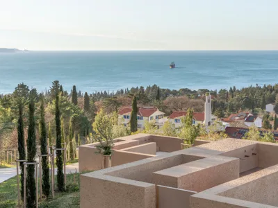 void arhitektura Terraces a Slovenian Cemetery into a Forest Ridge Above the Bay of Trieste