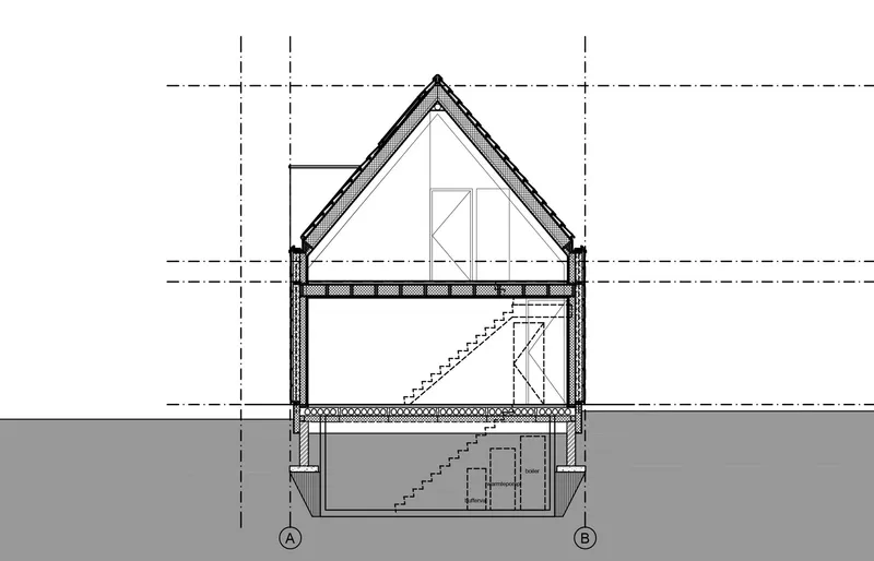 Section drawing showing pitched roof structure with interior stair descending to basement level