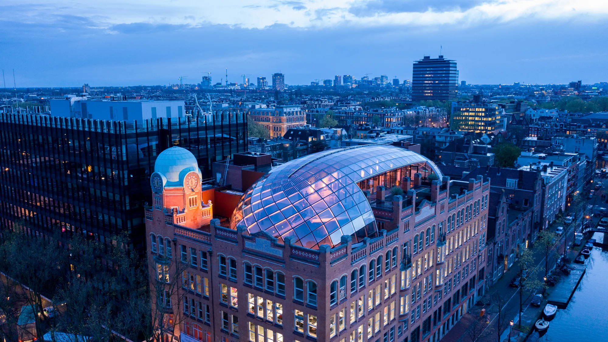 ZJA Crowns Amsterdam's 1911 Diamond Exchange with a Faceted Glass Dome
