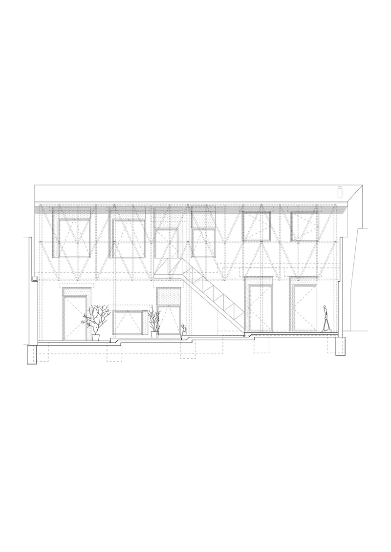 Section drawing showing diagonal bracing within the upper volume and openings to a planted courtyard