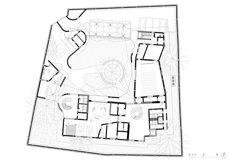 Ground floor plan drawing showing courtyards, spiral stair, and rooms arranged around a central circulation path