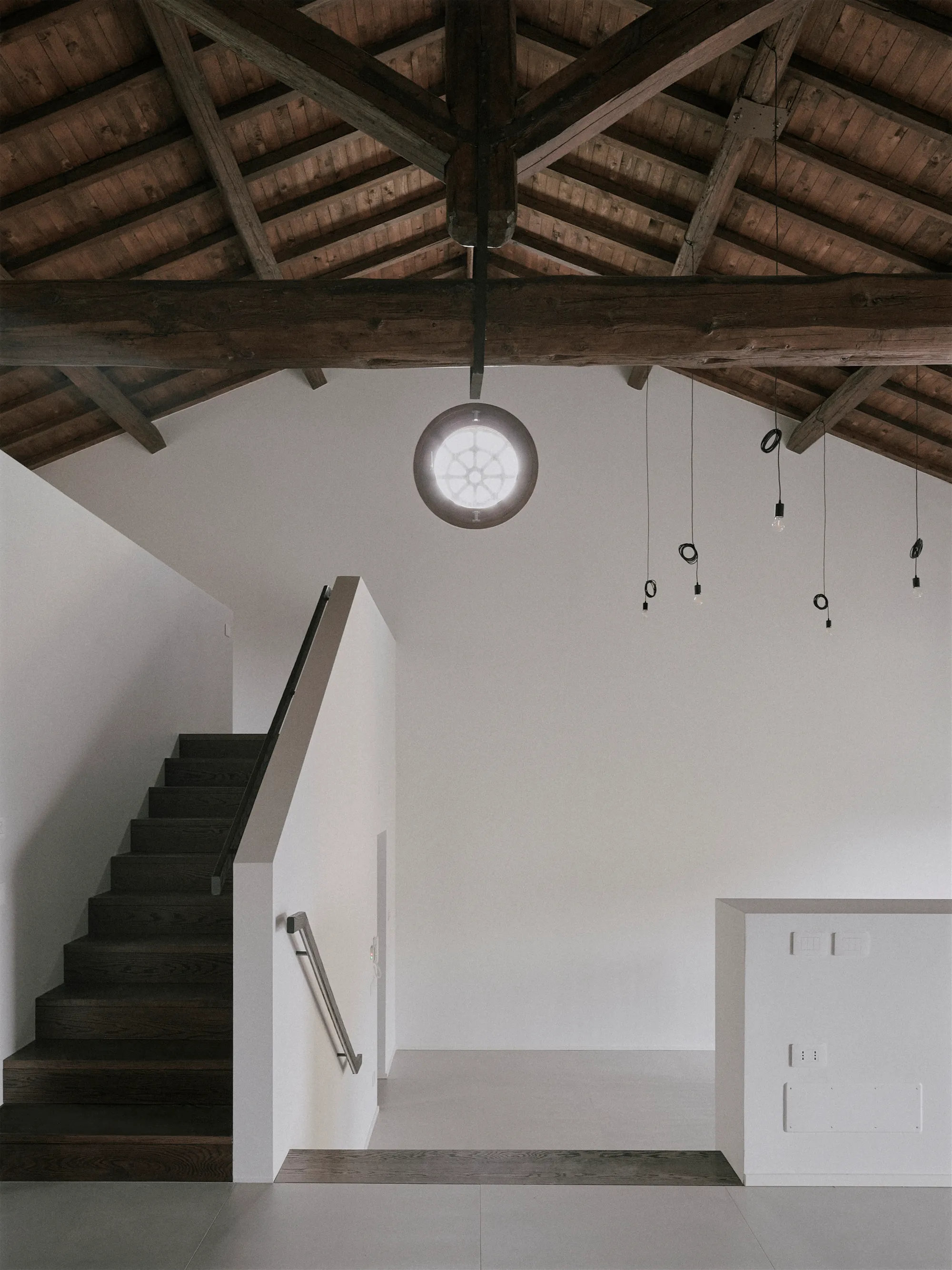 Tésa architetture Converts an Abandoned Emilian Barn into a Staggered-Level Home