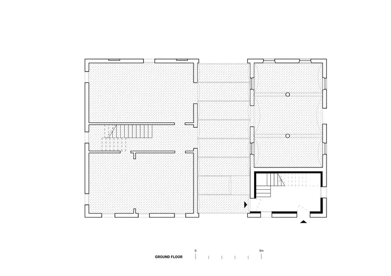 Ground floor plan drawing showing room divisions with central corridor and two staircases