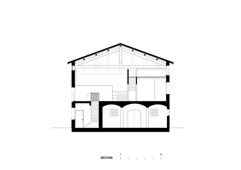 Section drawing revealing the pitched roof structure and multilevel interior with arched cellar openings
