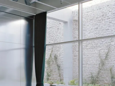 Office Zola Architectes Carves a Courtyard Out of a 44-Meter Industrial Hall in Vannes