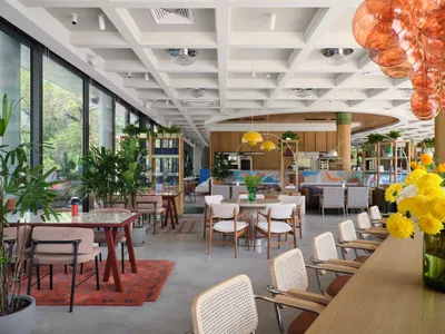 AT Interiors Revives a 1960s Almaty Landmark as the Swan-Themed Aqqu Central Café