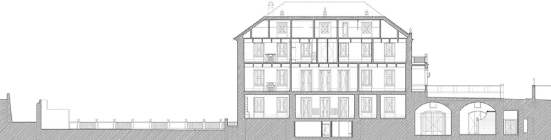 Section drawing cutting through a multi-storey building with timber framing and arched base