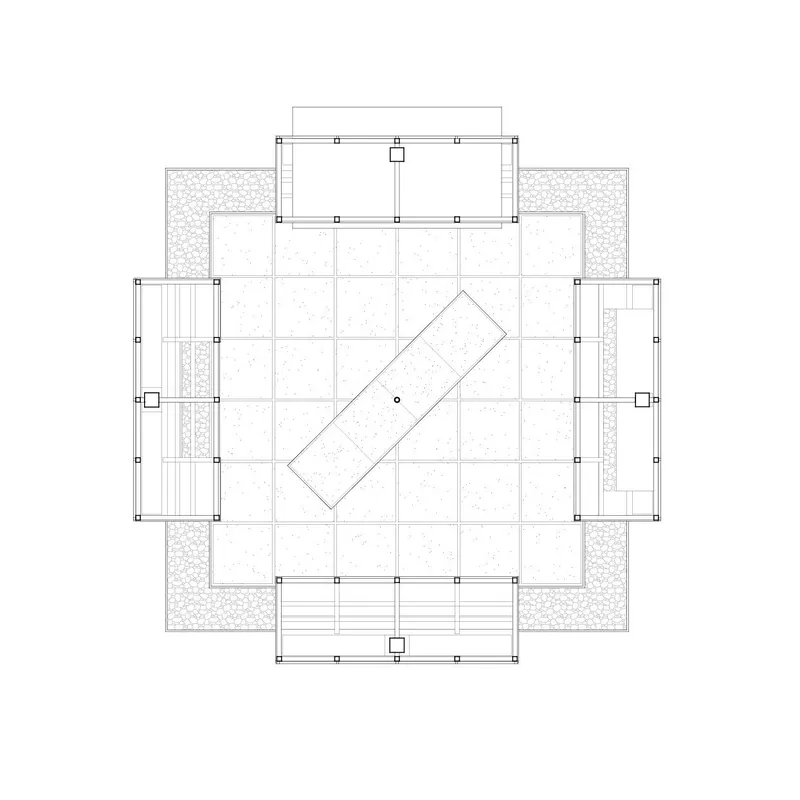 Floor plan drawing showing a central tilted rectangle surrounded by gridded spaces and gravel zones