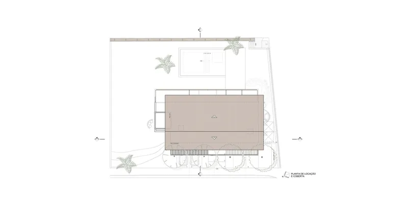 Site plan drawing showing a rectangular building volume surrounded by landscaping and pool