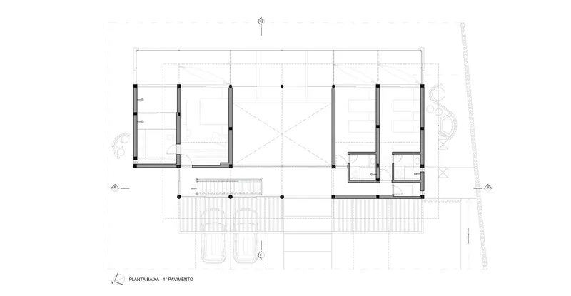 First floor plan drawing showing bedroom suites and a double-height void in the center