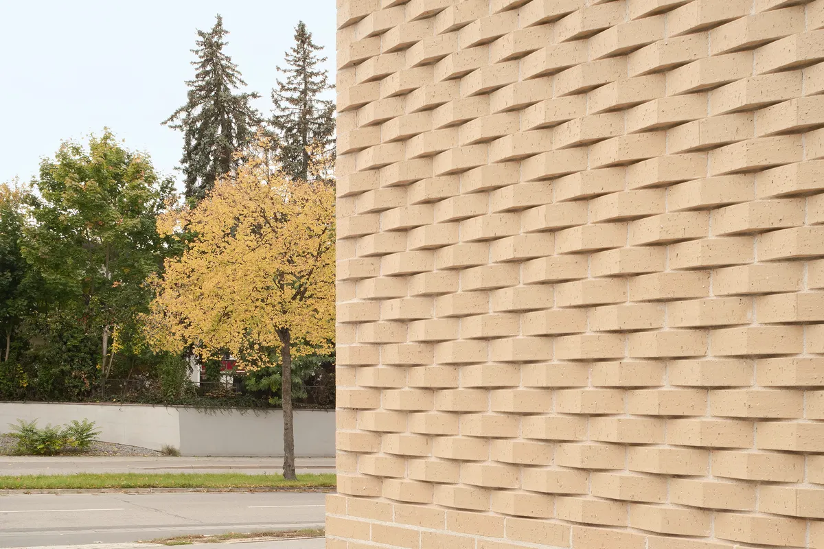 Bez+Kock Architekten Wrap a Regensburg Vocational School Extension in Custom Pentagonal Clinker