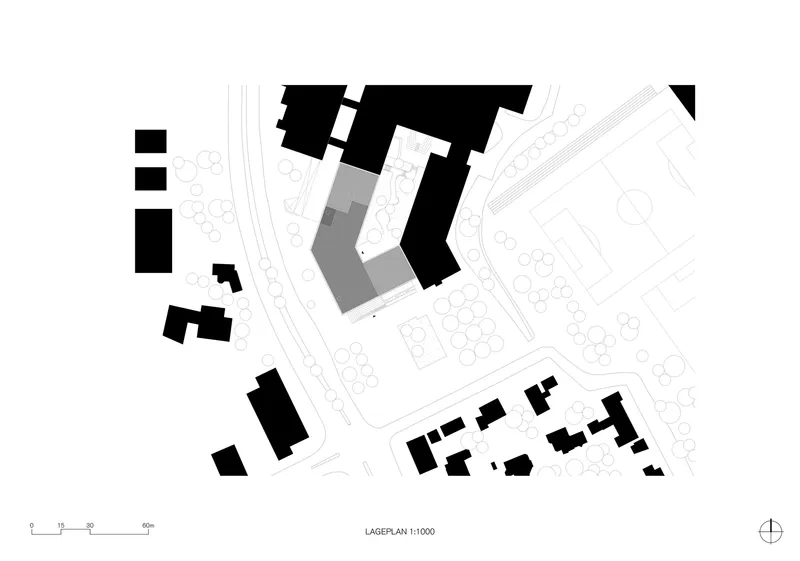 Site plan drawing showing the L-shaped building footprint among surrounding structures and street trees