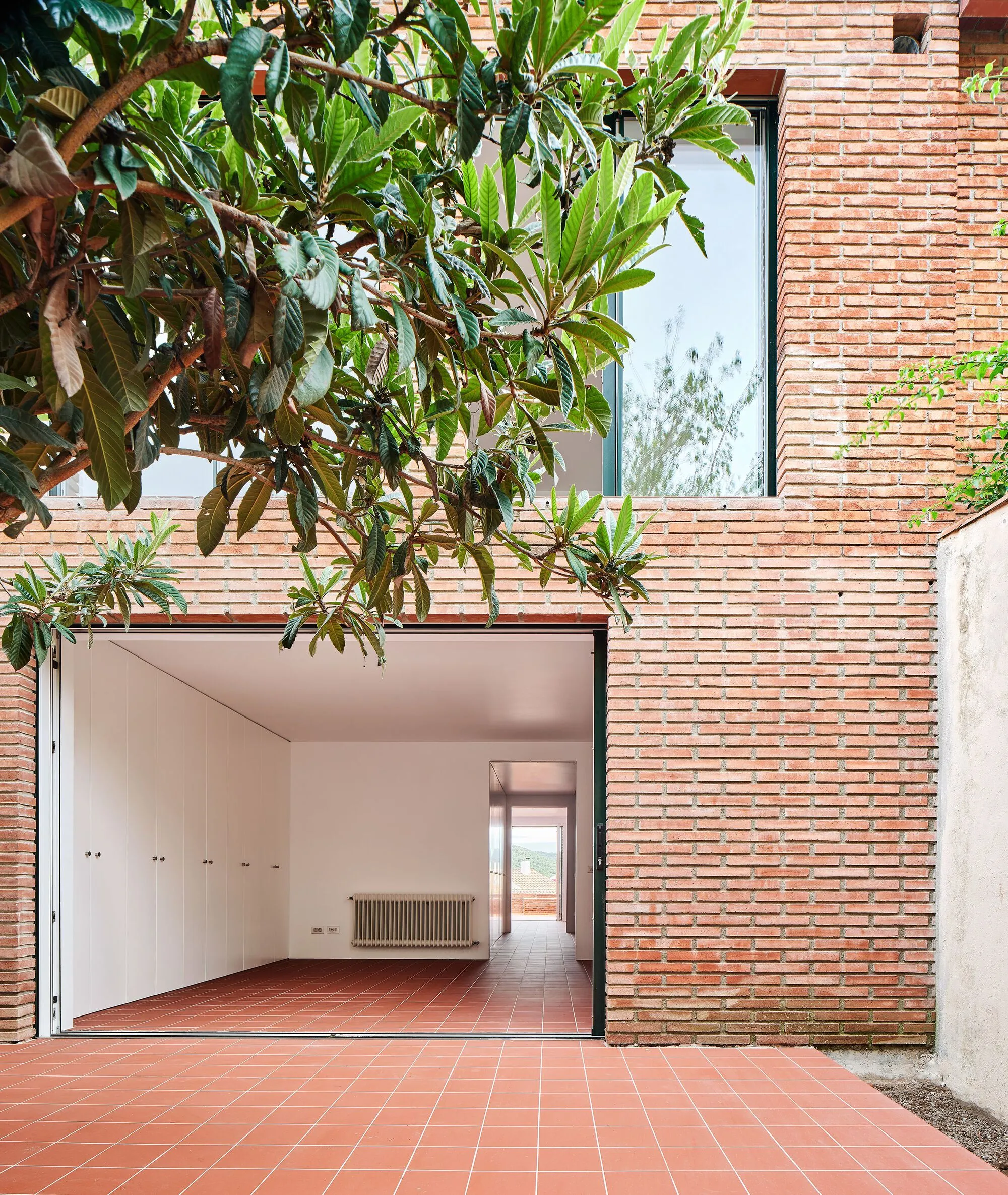 TALLER PONTI Flips a 1990s Row House in Sant Pere de Ribes by Entering Through the Garden