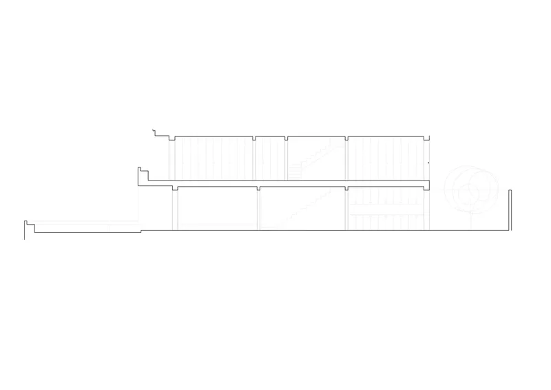 Section drawing showing a long horizontal volume with stepped roof levels and regular column spacing