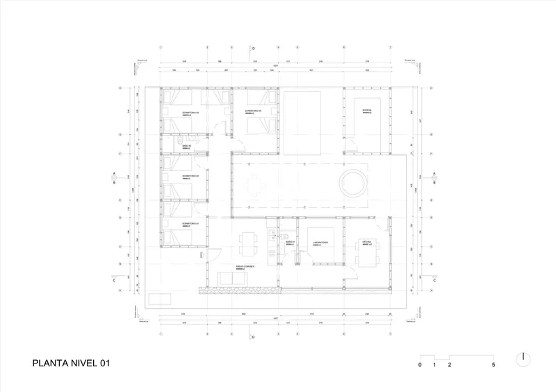 Floor plan drawing showing rooms arranged around a central courtyard with circular element