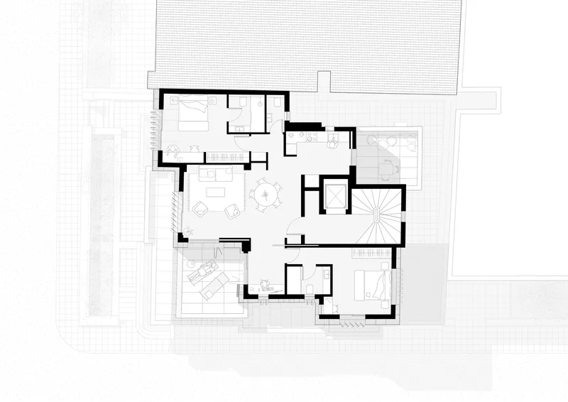 Floor plan drawing showing living spaces with a central spiral staircase and surrounding terraces