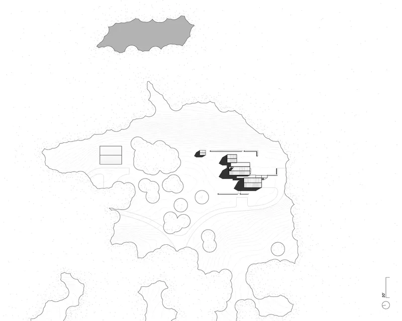 Site plan drawing showing the building footprint surrounded by landscaping and topography contours