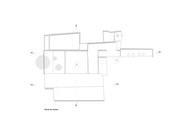 Roof plan drawing showing the relationship between existing and new volumes with a courtyard