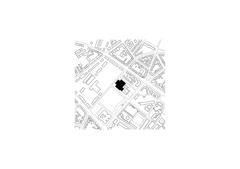 Site plan drawing showing the building footprint in black within the surrounding urban street grid