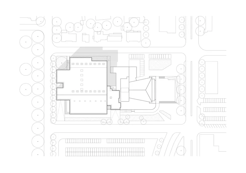Ground floor site plan drawing showing building footprint with surrounding trees and parking areas