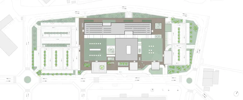 Site plan drawing showing the building complex with courtyards, parking areas and surrounding street trees