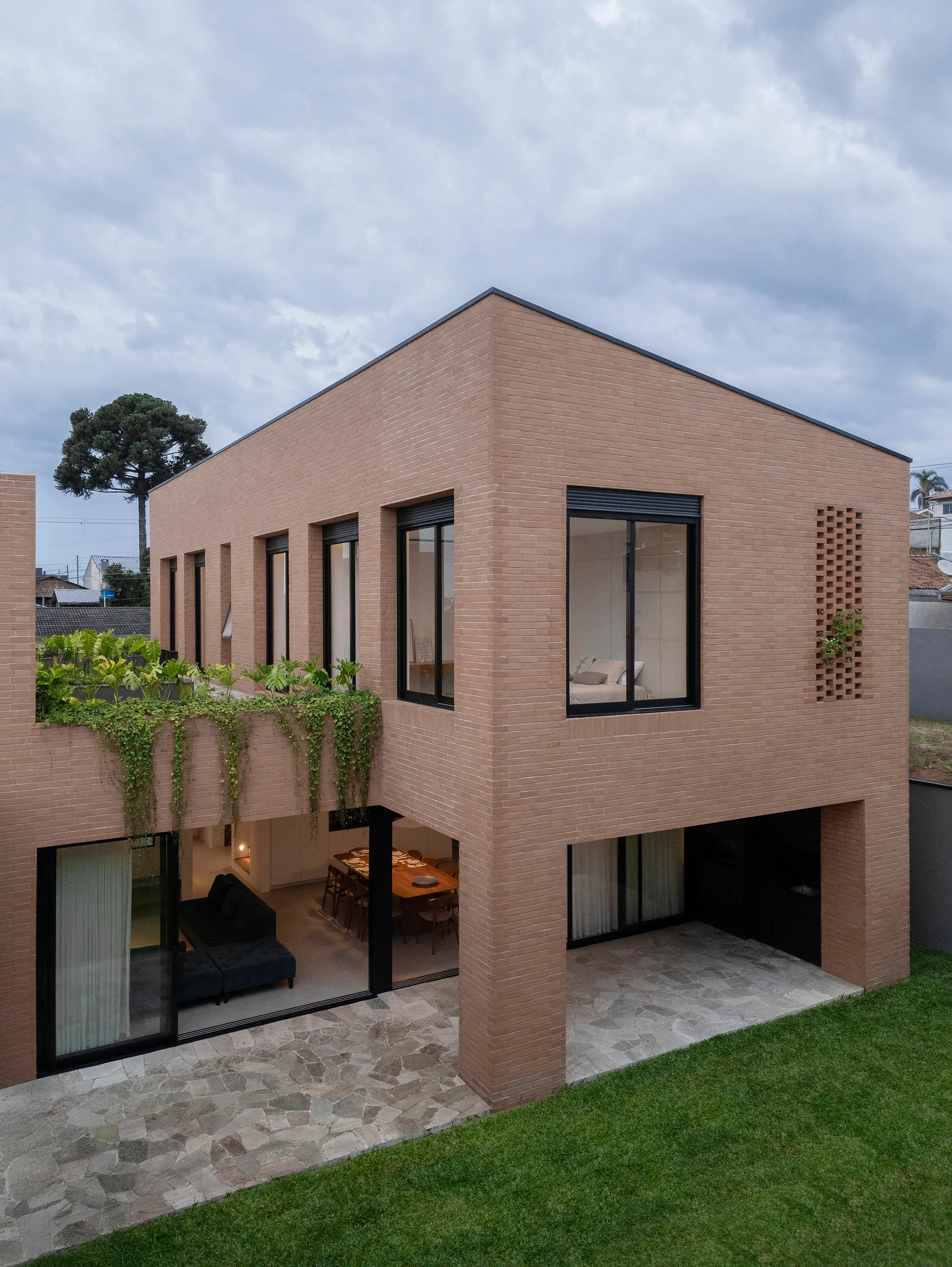 Nommo Arquitetos Sculpt a Brick Monolith for Four Generations in Southern Brazil
