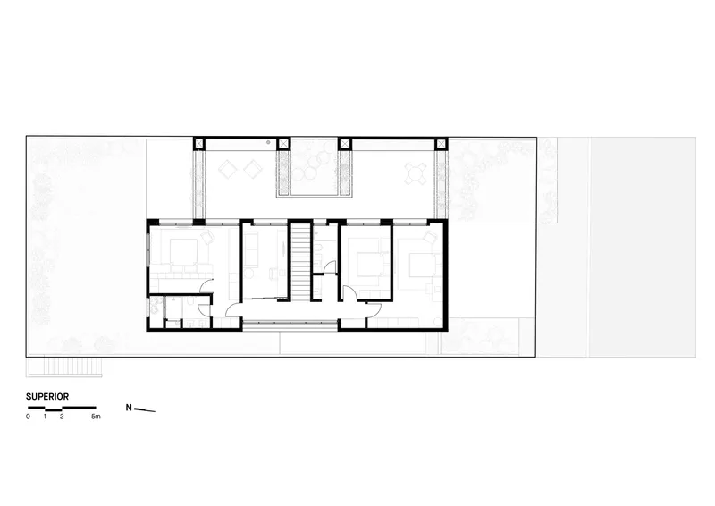Upper floor plan drawing showing bedroom layout with balconies projecting from the facade