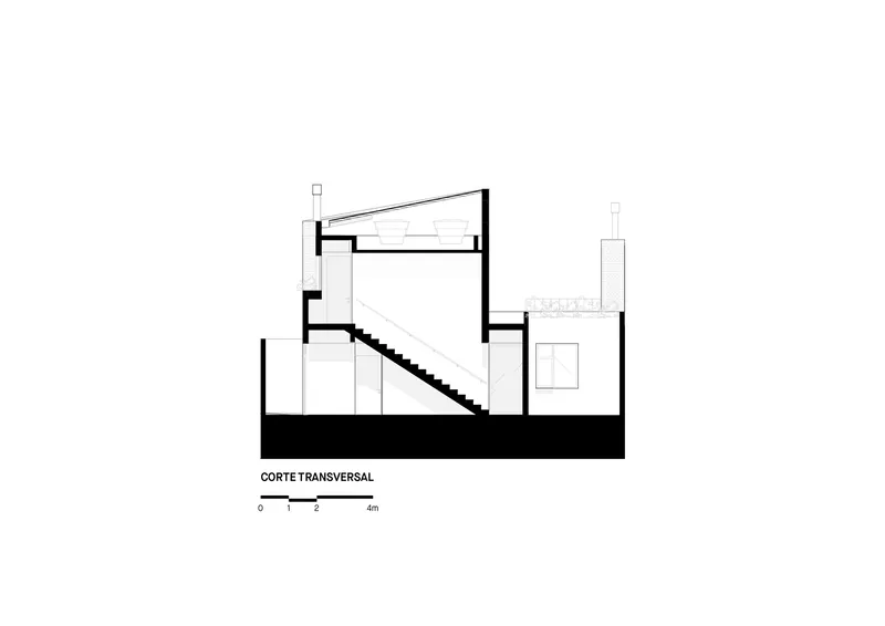 Transverse section drawing showing stair connecting two levels and sloped roof above