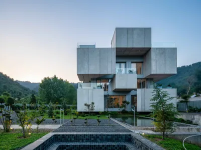 Bood Design Bureau Splits a Gilan Residence in Two to Let the Forest In