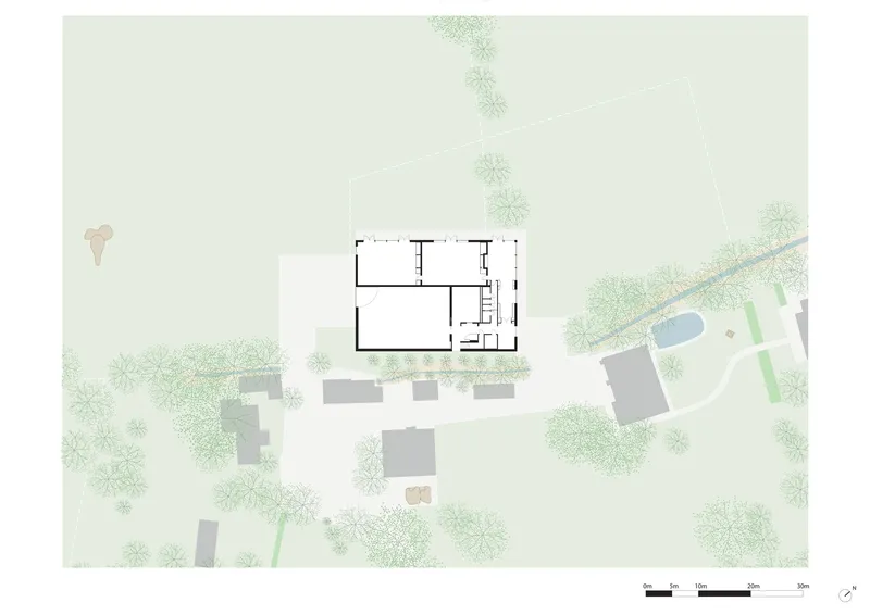 Floor plan drawing depicting rectangular volumes with surrounding landscape and neighboring structures
