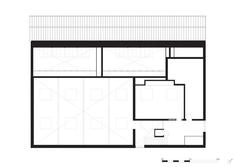 Section drawing showing gallery volumes beneath a corrugated roof structure with clerestory windows