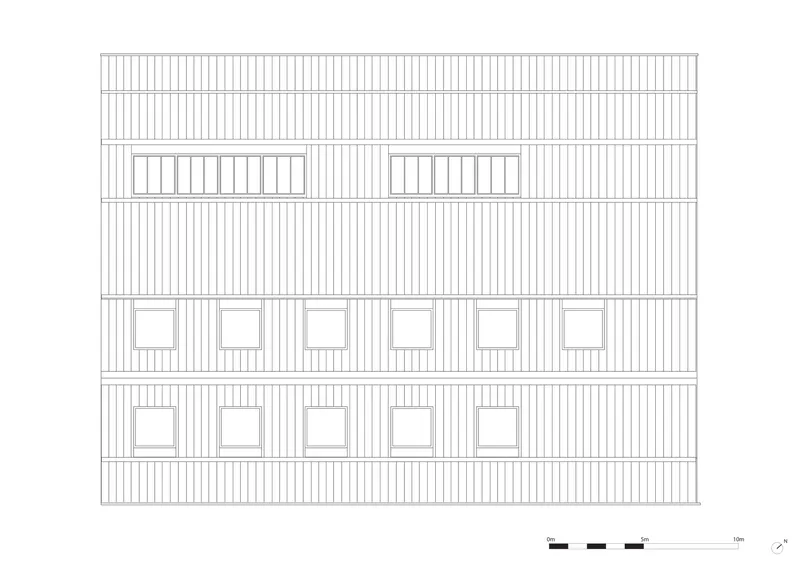 Elevation drawing of a vertical-clad facade with square windows and skylights at the roofline